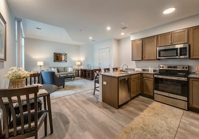 Modern kitchen and living area of a resident apartment