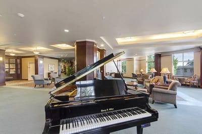 Interior view of a common area with a grand piano