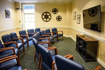 Interior waiting area with chairs and television
