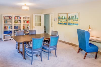 Bright common area with seating and bookshelves.