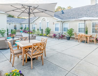 Outdoor patio area with tables and umbrellas