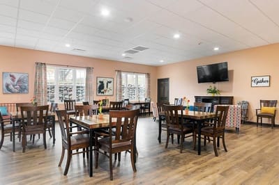 Bright dining area with wooden tables and chairs