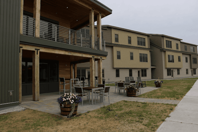 Exterior view of Morgan Orchards Senior Living Community with outdoor seating