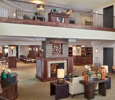 Interior view of a welcoming common area with fireplace