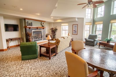 Bright common area with comfortable seating and a fireplace