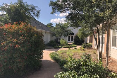 Pathway through a garden at Oak Park Village