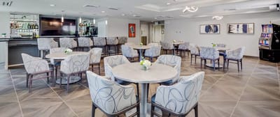 Bright dining area with tables and chairs