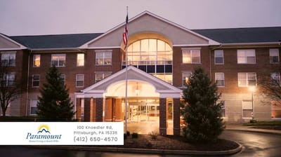 Exterior view of Paramount Senior Living building with logo