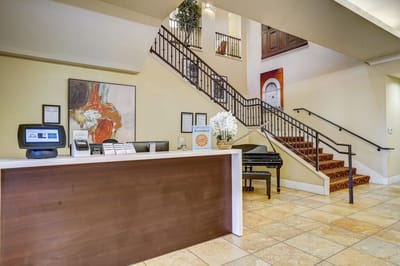 Interior view of the reception area with a staircase