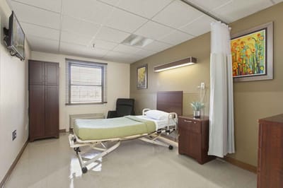 Comfortable resident room with bed and furnishings
