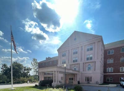 Exterior view of Pleasant View Center with flag and landscaping