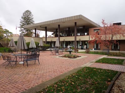 Outdoor patio area with seating and umbrellas