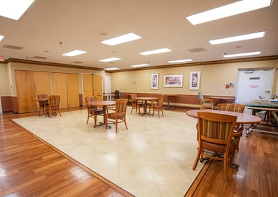 Spacious interior common area with tables and chairs