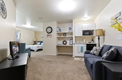 Cozy interior of a resident's room with a sitting area
