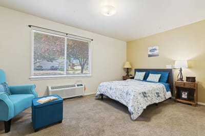 A cozy private room with bedding and decor
