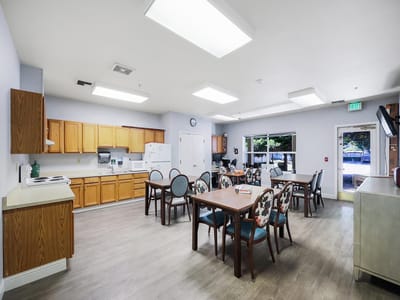 Bright dining area with tables and chairs