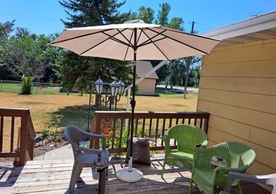 Outdoor seating area with a large umbrella