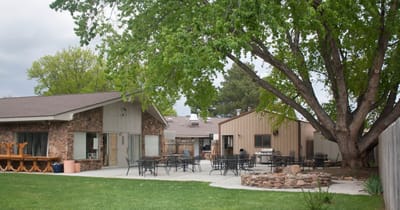 Outdoor courtyard area with seating and greenery