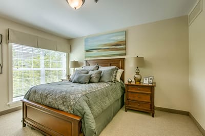 Cozy private room with a neatly made bed and decor