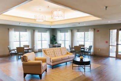 Bright common area with seating and tables