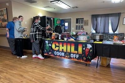 Residents participating in a chili cook-off event