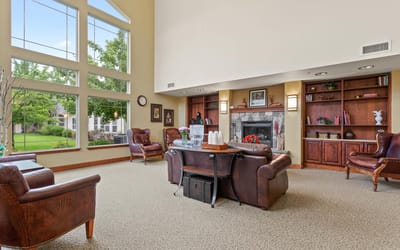 Interior common area with comfortable seating and bookshelves