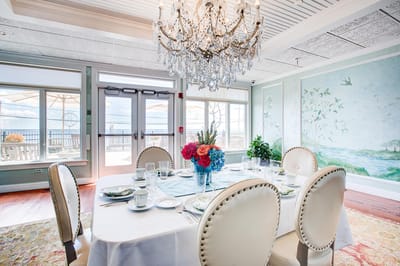 Elegant dining room set for a meal with floral centerpiece