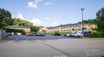 Exterior view of Capitol Ridge at Providence with parking lot