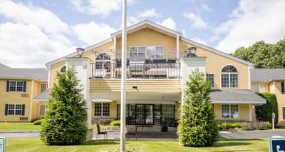 Exterior view of Capitol Ridge at Providence with landscaped entrance