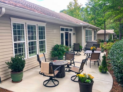 Outdoor seating area with plants and flowers
