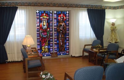 Common area with stained glass windows and seating
