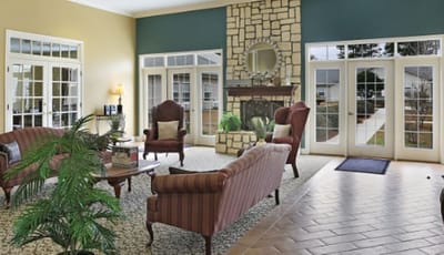 Interior common area with seating and a fireplace