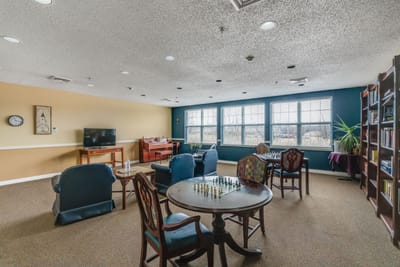 Interior common area with seating and game tables