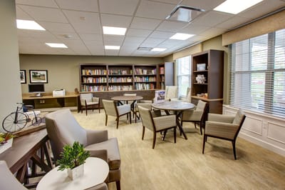 Bright and inviting common area with bookshelves