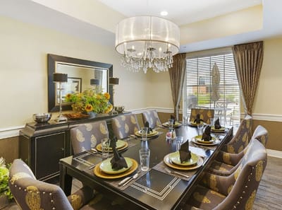 Elegant dining room with a chandelier and large table