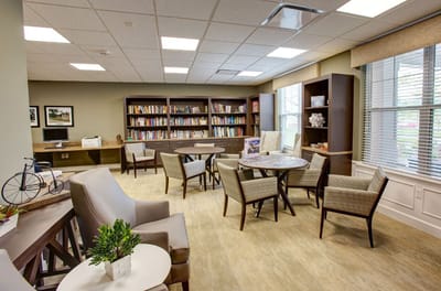 Cozy common area with bookshelves and seating