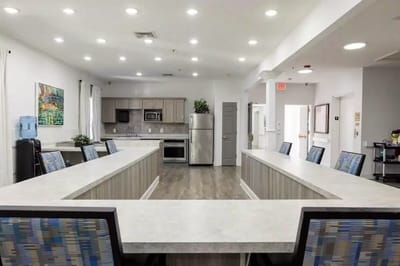 Bright, modern kitchen area with seating