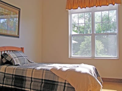 Cozy resident room with bed and natural light