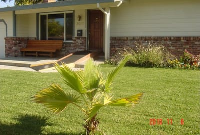 Front exterior of a senior living facility with lawn
