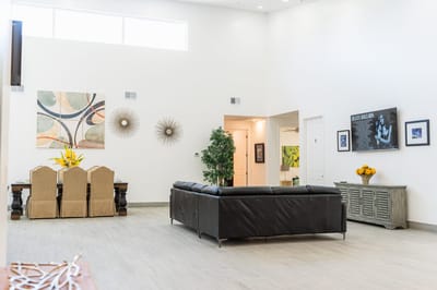 Bright common area with seating and art decor
