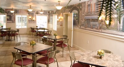 Bright dining room with tables and floral decor