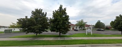 Exterior view of Tambree Meadows with trees and parking