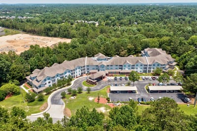 Aerial view of the senior living facility surrounded by greenery
