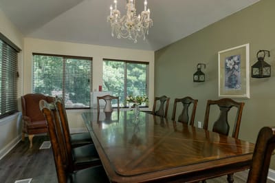 Dining room with a large table and chandelier