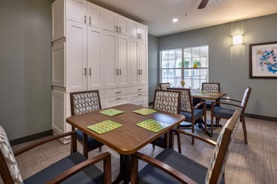 Bright common area with tables and chairs
