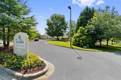 Entrance of the assisted living facility with landscaped surroundings