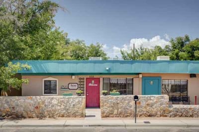 Front exterior of The Adobe with landscaping