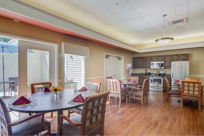 Bright dining room with tables set for a meal