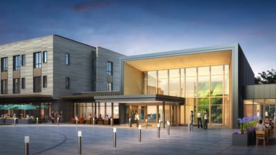 Exterior view of assisted living facility with outdoor seating