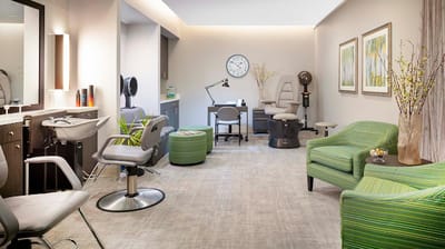 A well-lit beauty salon area with modern furnishings